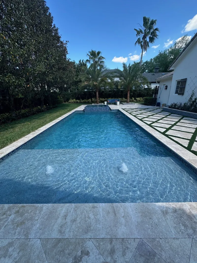 Signature sun shelf detail in a custom pool — Next Level Pools and Spas 11