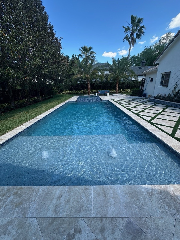 Brick patio to travertine deck + raised spa — after, view 2